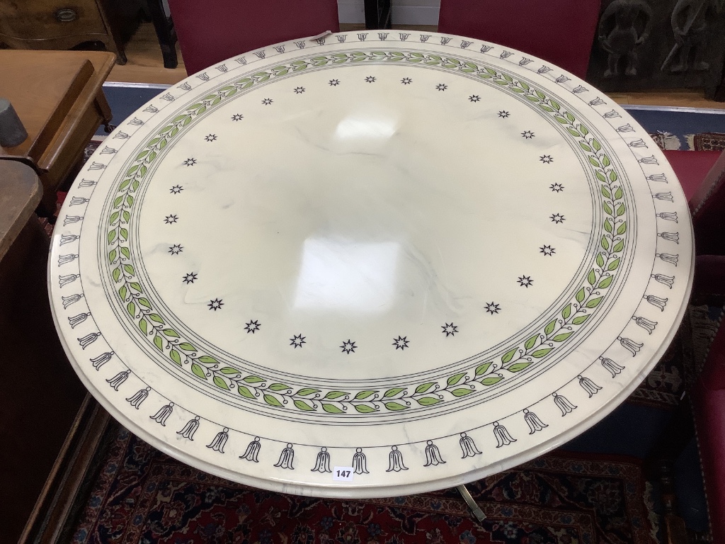 A modern circular dining table, with faux marble top on gilt metal base with splayed legs, diameter 134cm height 72cm